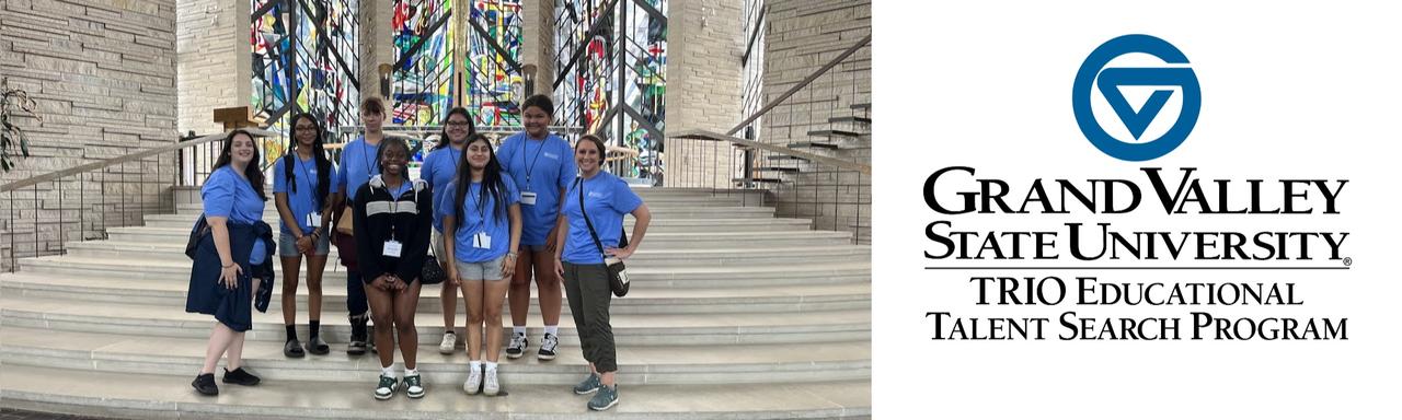 TRIO students and staff pose on a staircase